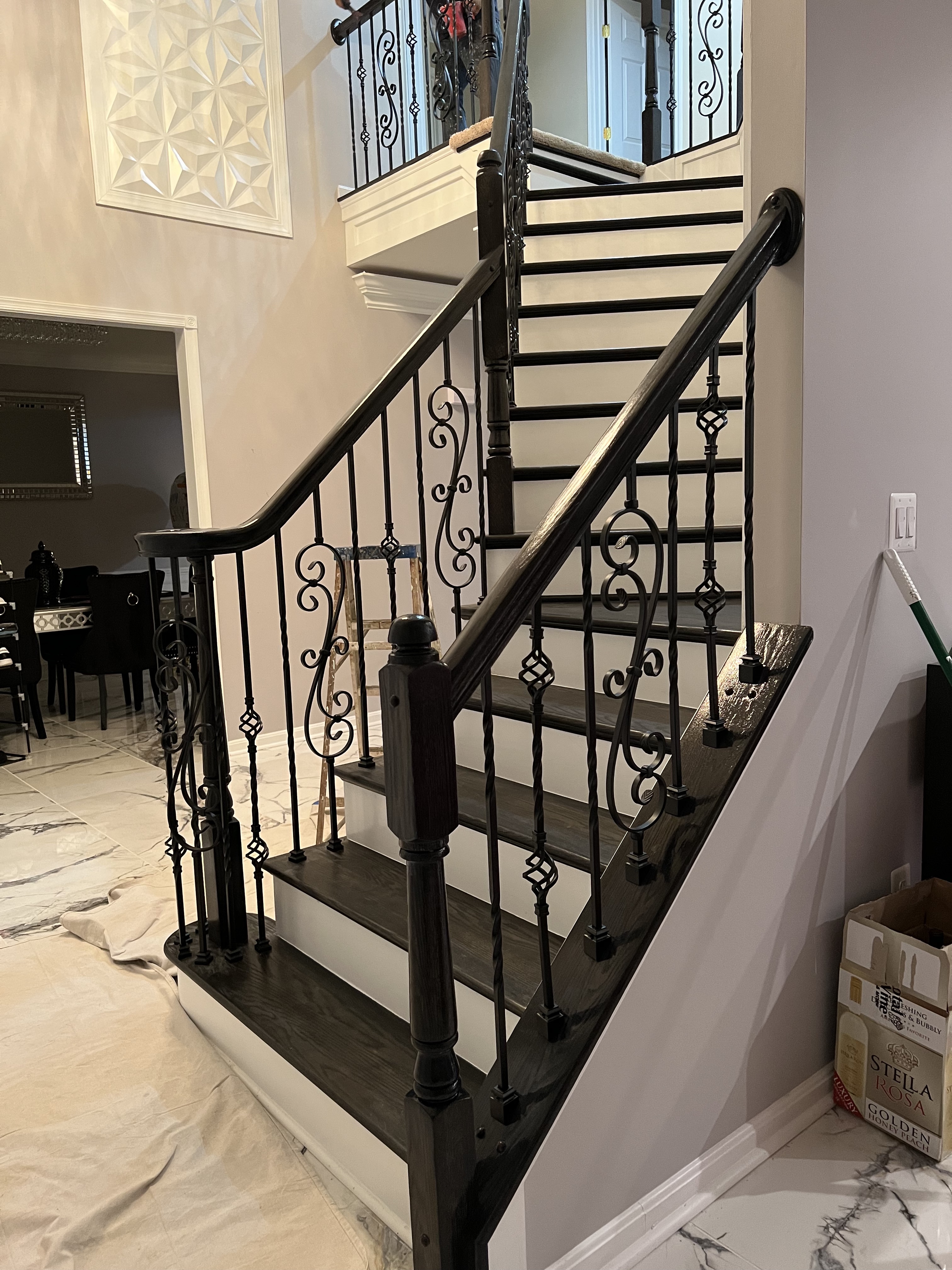 Black staircase with accented rails.