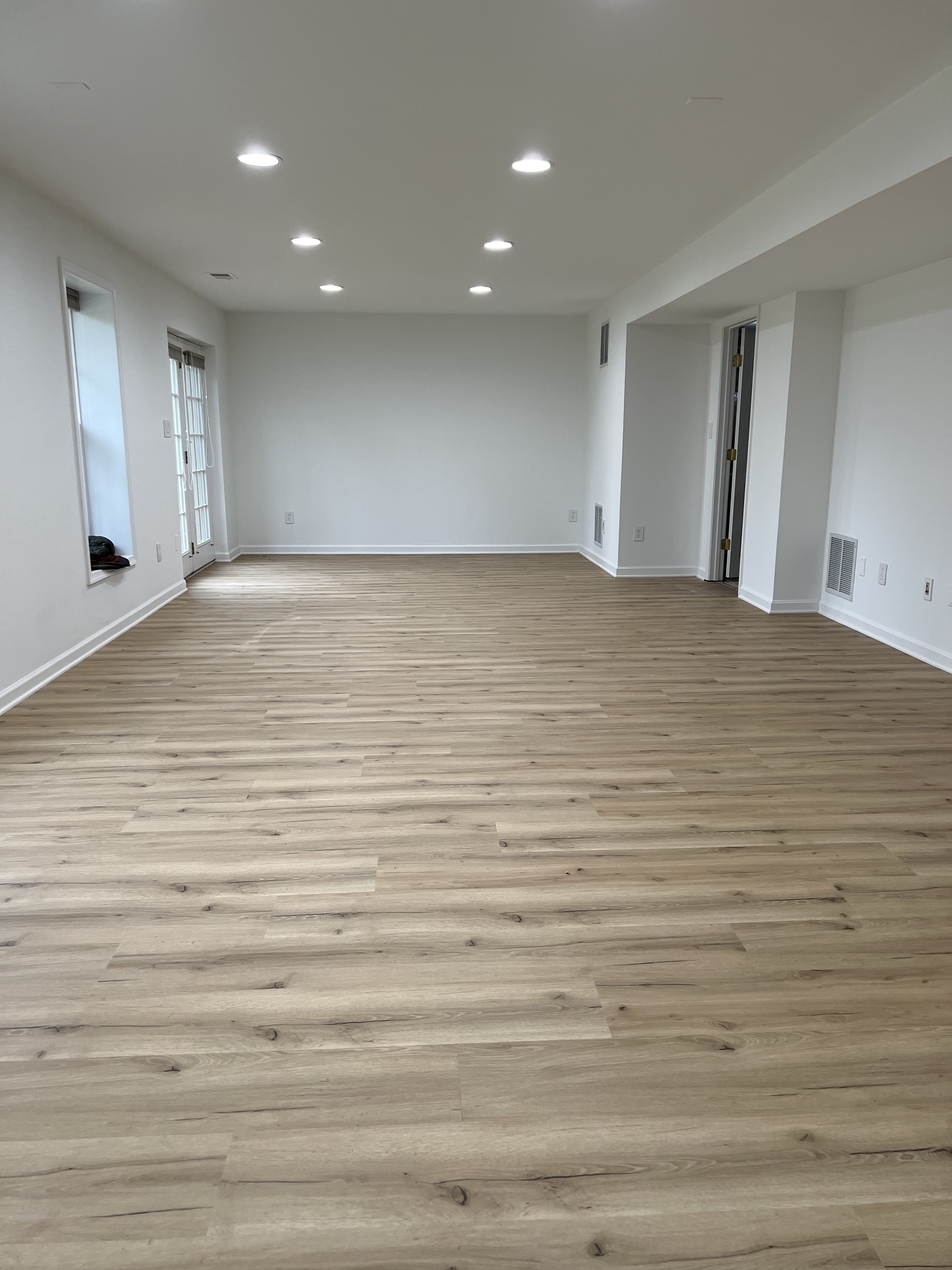 Light wood floor in finished basement.